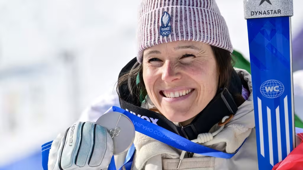 Athlètes français célébrant une médaille aux JO de Milan-Cortina 2026